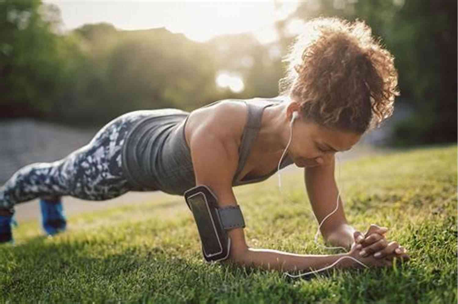 Woman Performing A Plank Exercise HOME WORKOUTS FOR WOMEN HOT ABS EXERSISES IN PICTURES